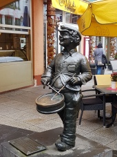 The drunken drummer boy (the bottle of schnaps is in his left pocket) warned the Prussians when the French army neared.